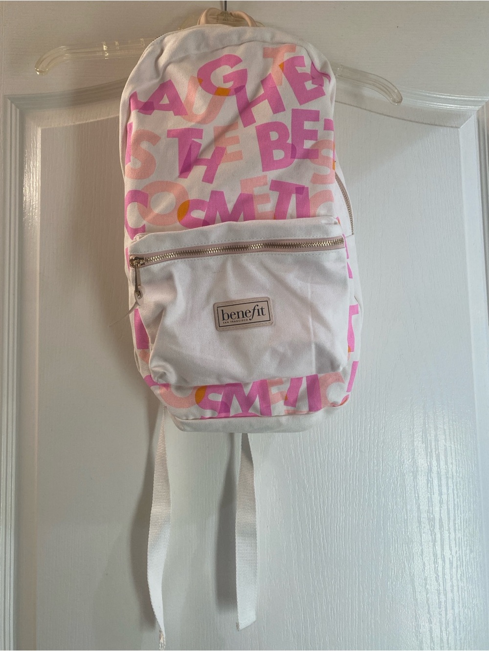Benefit White Canvas Backpack with Pink and Peach Graphic Print